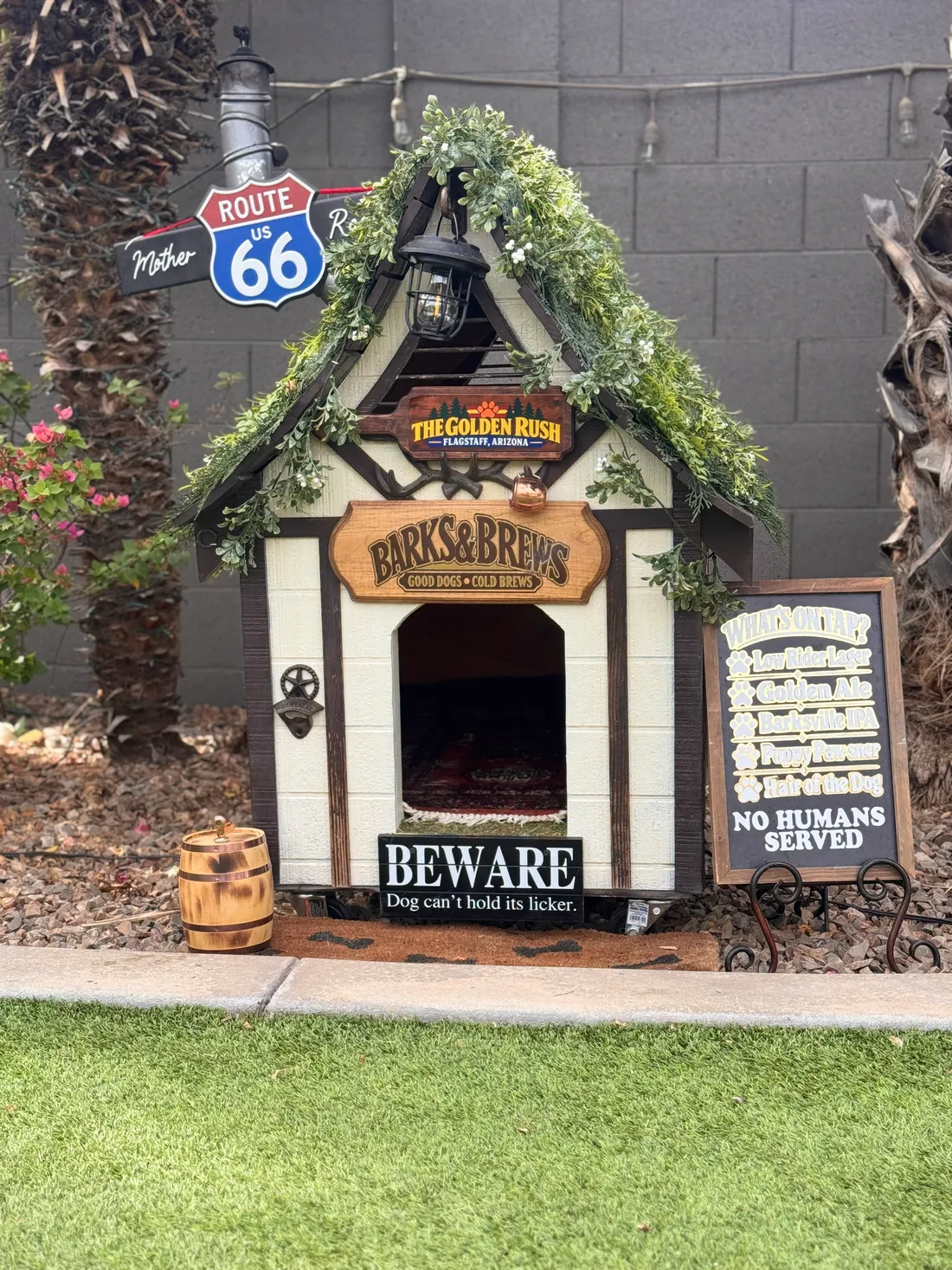 Barks and Brews dog house and tiny tap list